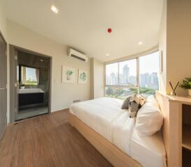 Spacious bedroom with city view