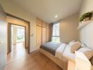 well-lit modern bedroom with a view