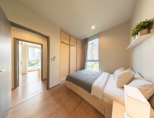 well-lit modern bedroom with a view