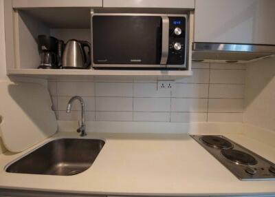 Modern kitchen with appliances, sink, and cooktop