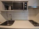 Modern kitchen with appliances, sink, and cooktop