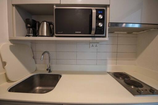 Modern kitchen with appliances, sink, and cooktop