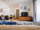 Bright and modern living room with a dining area and a TV unit