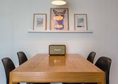 Modern dining area with wooden table and stylish chairs