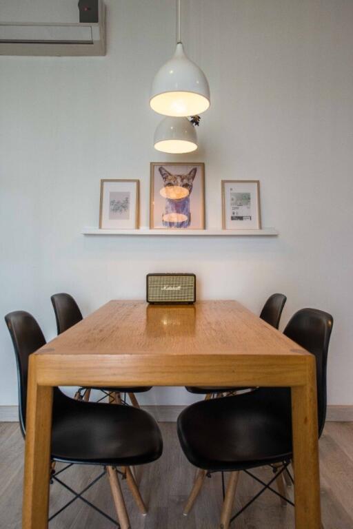 Modern dining area with wooden table and stylish chairs