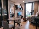 Modern living room with furniture, dining table, and a view of another room