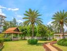 Well-maintained garden area with gazebo and palm trees