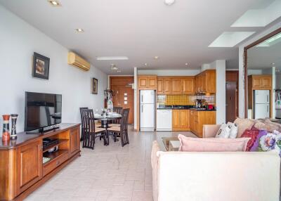 Open-concept living room with adjacent kitchen