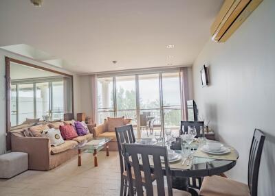 Modern living room with dining area and large window