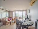 Modern living room with dining area and large window