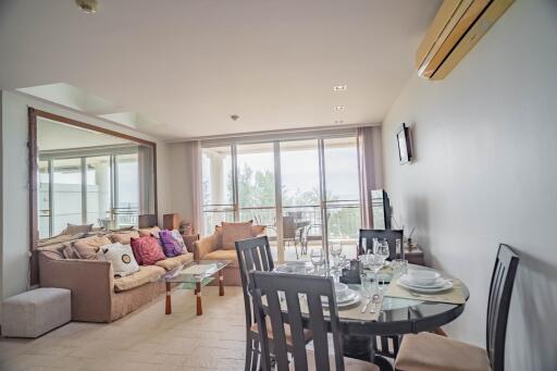 Modern living room with dining area and large window