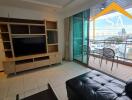 Modern living room with balcony and city view