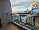 Balcony with a view of the city and the sea