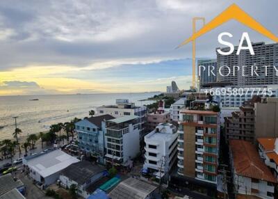 Aerial view of a coastal city with multiple residential buildings and a beach