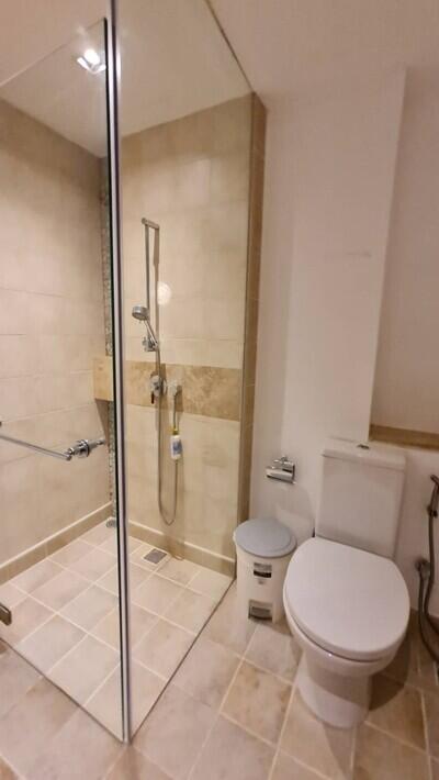 Modern bathroom with a glass shower and tiled flooring