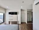 Modern bedroom with large window, shelves, and wooden flooring