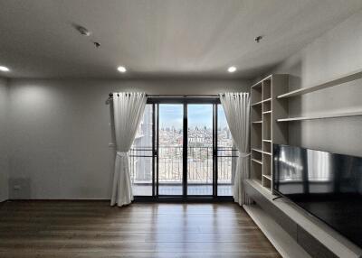 Modern living room with large windows and city view