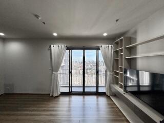 Modern living room with large windows and city view