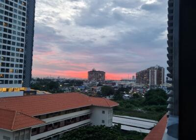 View from apartment with cityscape and sunset