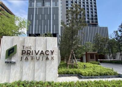 Outdoor view of The Privacy Jatujak building with surrounding greenery