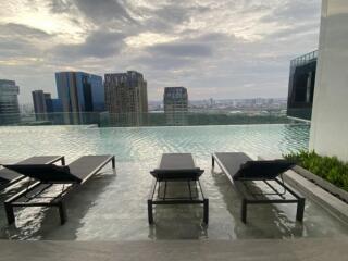 Rooftop infinity pool with city skyline view