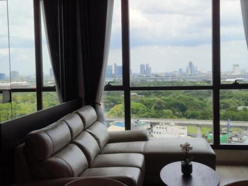 Living room with large windows and city view