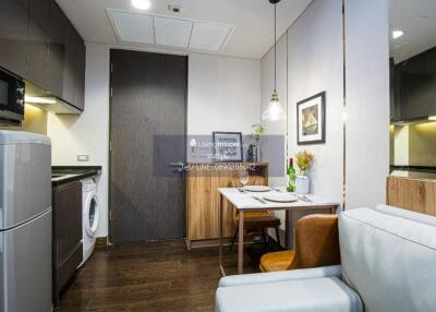 Compact kitchen and dining area with modern appliances and decor