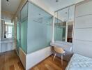 Modern bedroom with glass-paneled shower enclosure