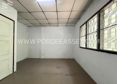 Unfurnished room with windows