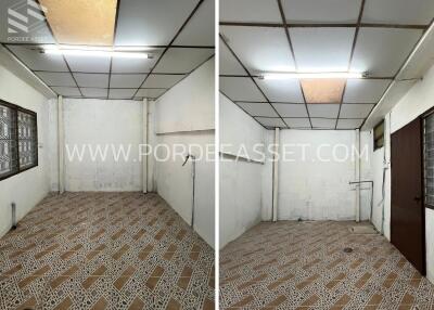 Empty room with patterned tile flooring and white walls