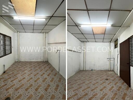 Empty room with patterned tile flooring and white walls