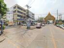 Street view of a commercial building and nearby area