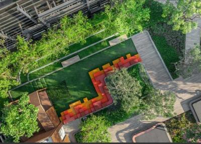 Aerial view of a vibrant outdoor seating area surrounded by greenery