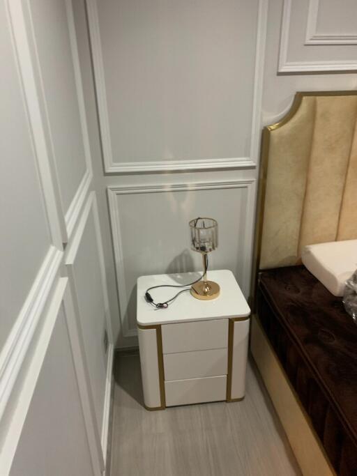 Nightstand with lamp in bedroom