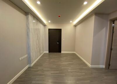 Spacious hallway with recessed lighting and hardwood floor