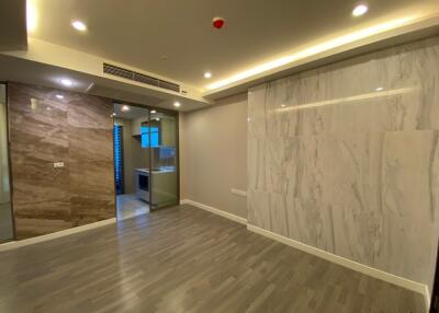 Modern living room with wooden floor and marble accent wall