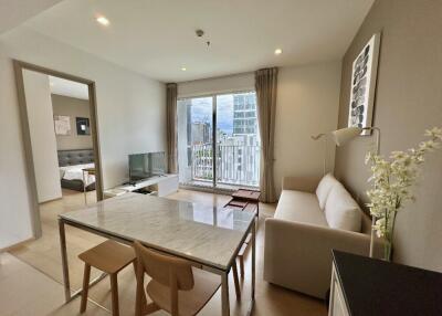 Modern living room with dining area and large windows