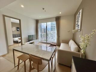 Modern living room with dining area and large windows