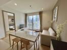 Modern living room with dining area and large windows