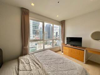 Modern bedroom with large window view