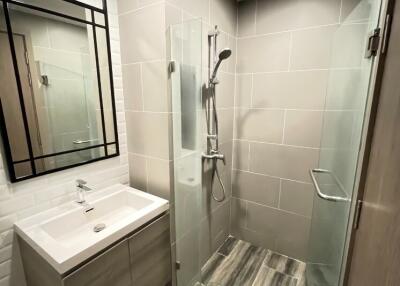 Modern bathroom with a walk-in shower and vanity