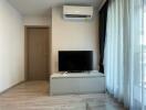 Living room with air conditioning and TV