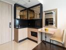 Modern compact kitchen with small dining area