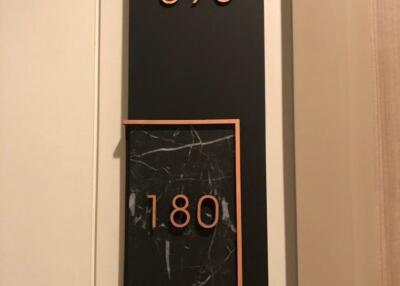 Building address plaque showing suite number 598 and 180