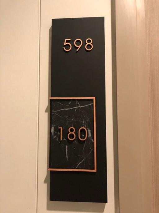 Building address plaque showing suite number 598 and 180