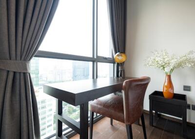 Cozy bedroom with study table and large window