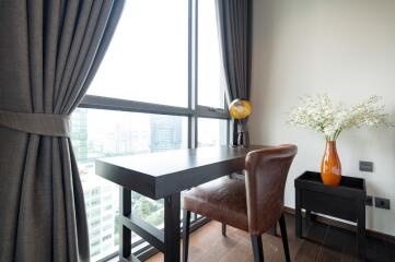 Cozy bedroom with study table and large window