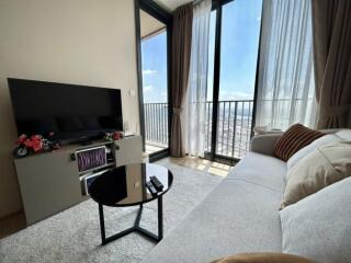 Modern living room with large windows and city view