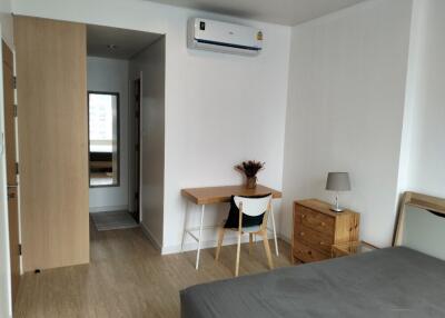 Bedroom with desk and air conditioner