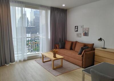 Modern living room with large window and city view